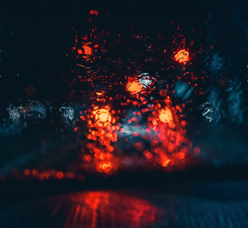 Blurry wet car lights shot from inside of a car